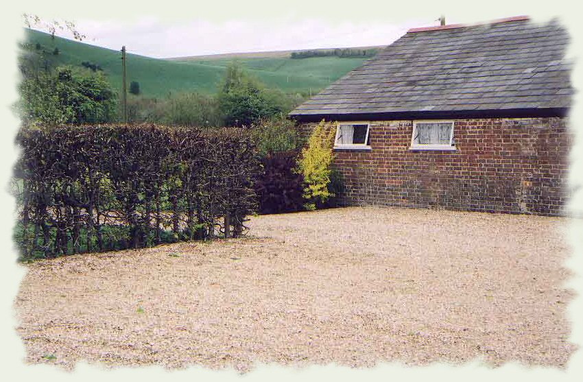 Side of Chalet showing parking area