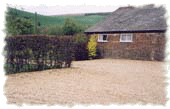 Side of Chalet showing parking area